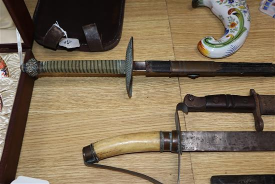 A bone-handled sword, a French epee, a Remington bayonet and a dagger